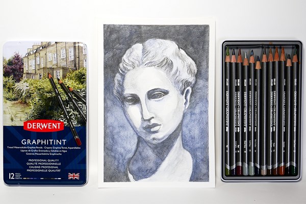 Sculpture drawing next to Graphitint pencils in tin case